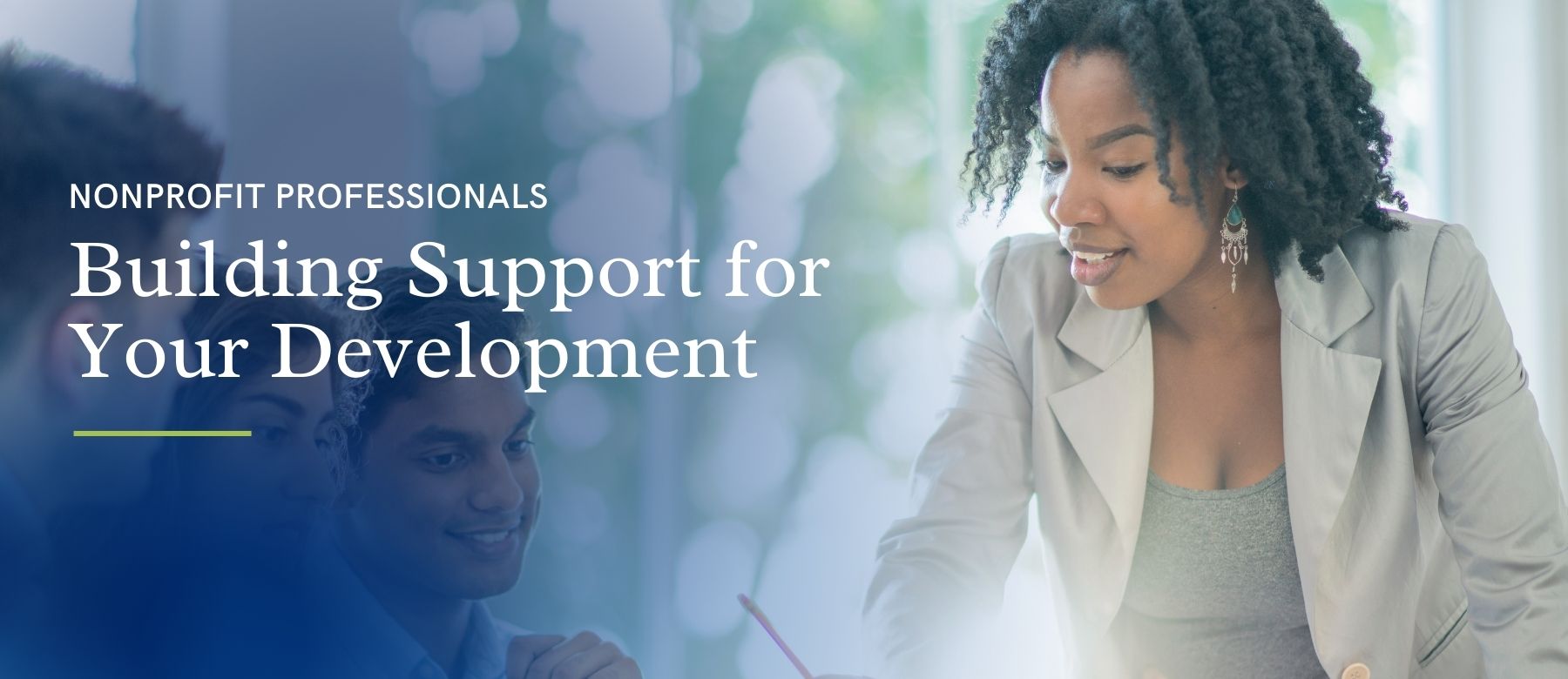 Text is "building support for your professional development" with female in a blazer presenting at a larger meeting