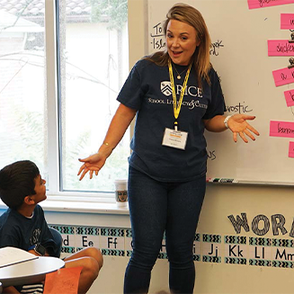 teacher in front of whiteboard