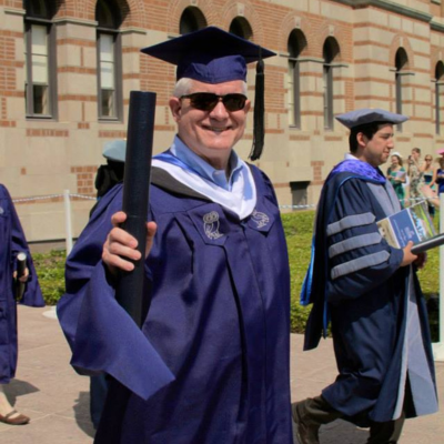 Alum after receiving diploma